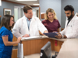 Team gathered around nurses station