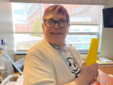 Laurie Gerow works on crafts after rehabilitation.